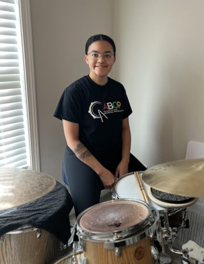 Ashlee Dudley behind a drumset