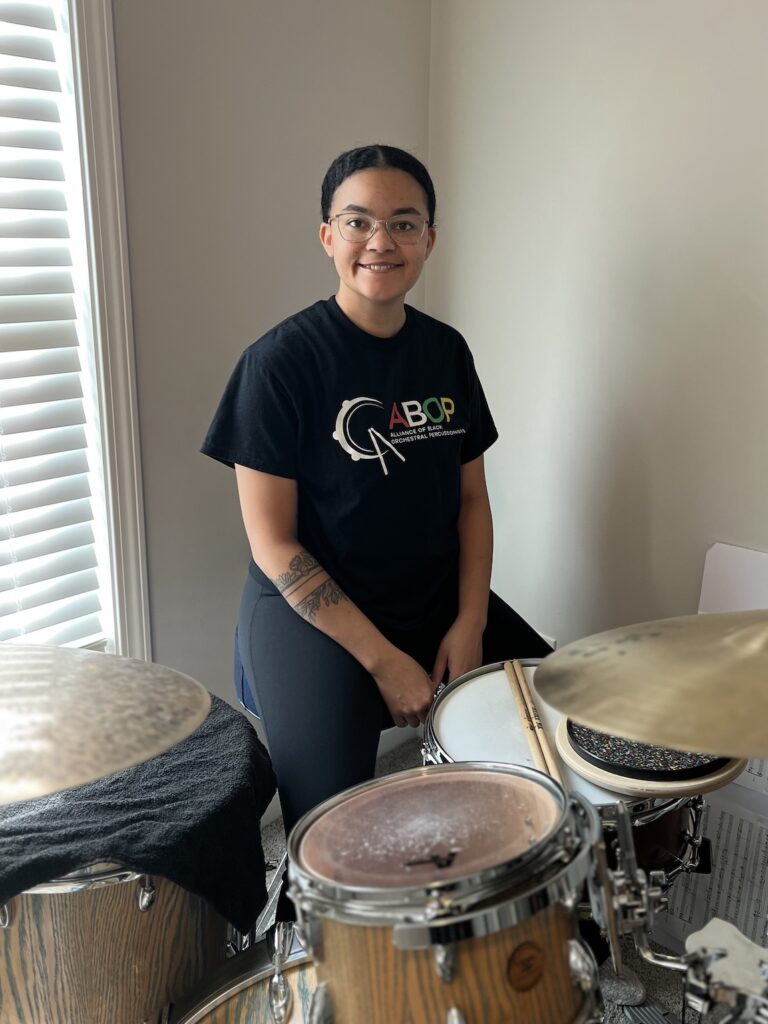 Ashlee Dudley behind a drumset
